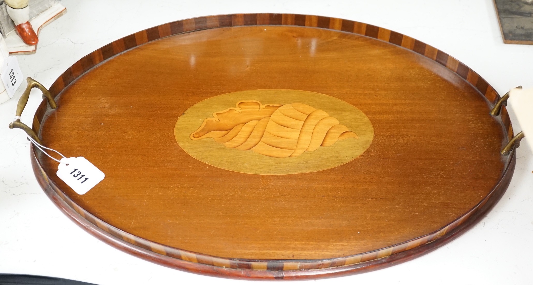 An Edwardian oval inlaid tea tray. 61cm long